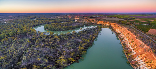 Wall Mural - Aerial panoramic landscape of eroding sandstone shores of Murray RIver at dusk