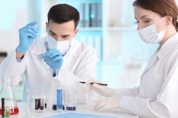 male and female scientists working in laboratory
