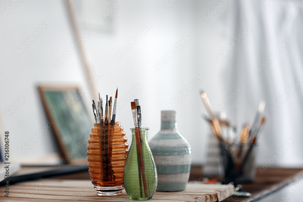 Set of paintbrushes on table in workshop