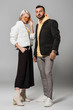 © LIGHTFIELD STUDIOS - fashionable couple of models in autumn outfits posing on grey background