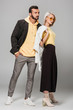 © LIGHTFIELD STUDIOS - young stylish couple posing in autumn outfits on grey background