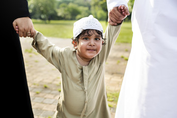 Sticker - Cheerful Muslim boy in the park