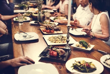 Wall Mural - Group of diverse friends are having a dinner together