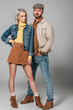 © LIGHTFIELD STUDIOS - attractive couple posing in autumn outfit for fashion shoot, on grey