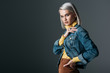 © LIGHTFIELD STUDIOS - attractive girl in yellow turtleneck and fashionable jeans jacket, isolated on grey