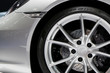 Detailing series. Clean super car disc-brake. Black rims from sports car..