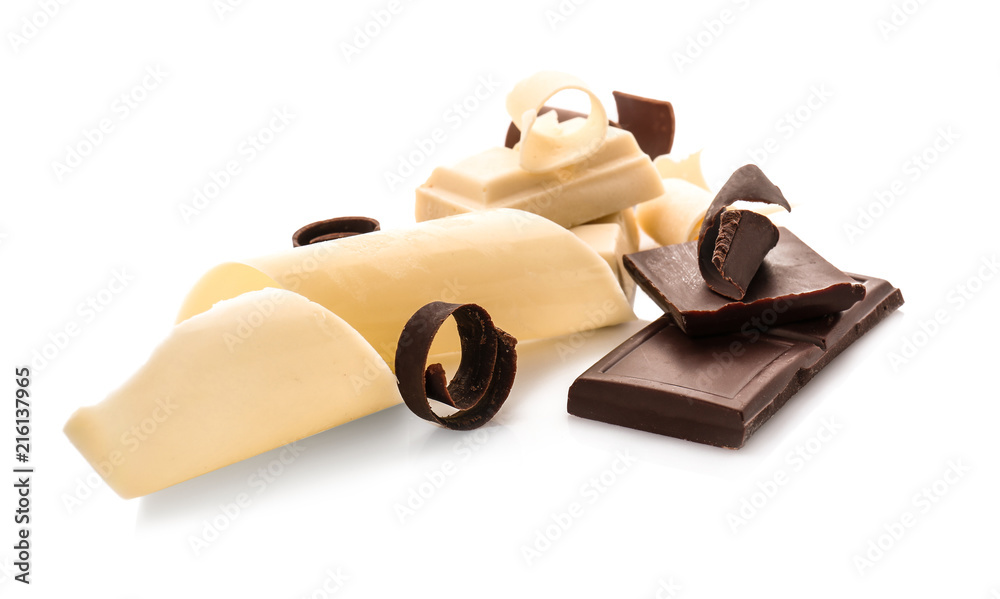 Pieces of chocolate with curls, isolated on white