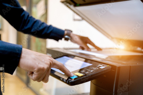 Fotografía Bussiness man Hand press button on panel of printer, printer scanner laser office copy machine supplies start concept