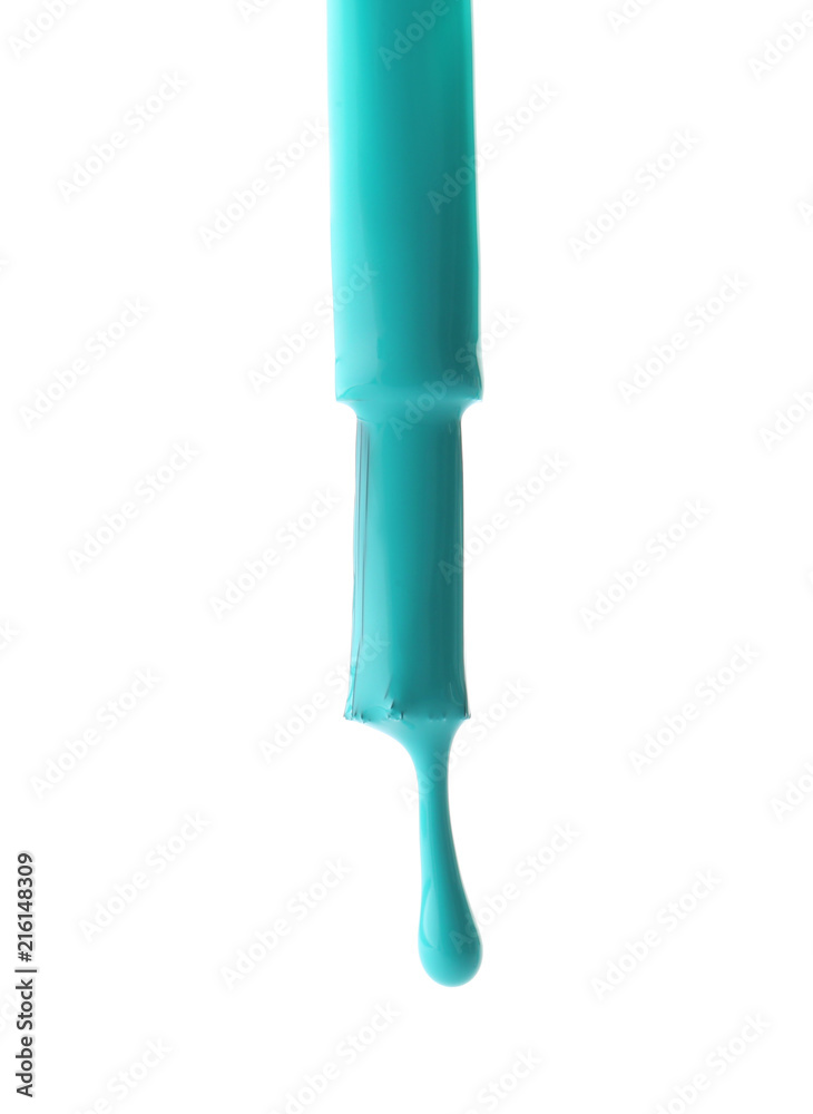 Brush with dripping nail polish on white background
