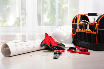 Wall Mural - Bag with different electrician's tools and scheme on floor