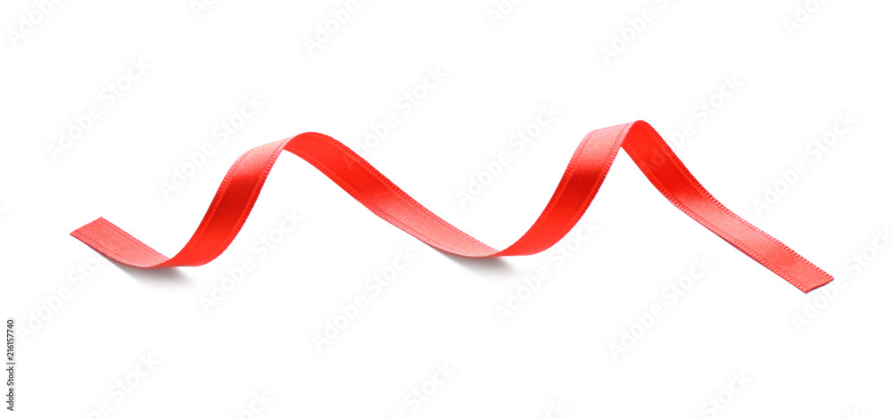Curled red ribbon on white background