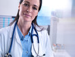 © Connect Images - Portrait of doctor with stethoscope looking at camera