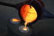 Foundry - molten metal poured from ladle into mould