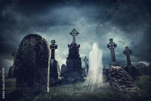 Spooky old graveyard and a ghost Tableau sur Toile