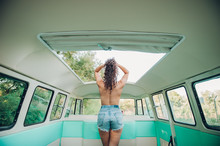 Anonymous Topless Woman Standing Inside Van