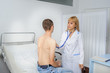 © Med Photo Studio - The doctor is consulting the patient with ultrascope at his back