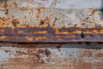 Wall Mural - painted iron surface with a large rusty and metal corrosion, old background with peeling and cracking paint as background, texture