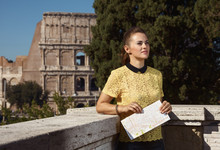 Modern Tourist Woman With Map Looking Into Distance