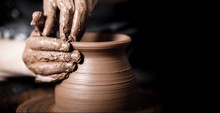 Hands Of Potter Making Clay Pot