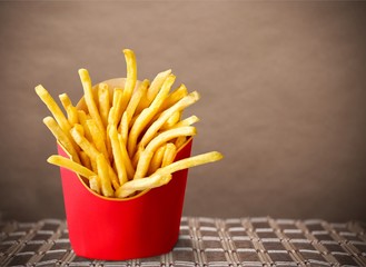 Wall Mural - French fries in a red carton box