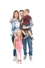 Portrait of happy family with little children on white background