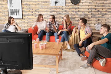 Sticker - Young people watching and discussing movie in home cinema