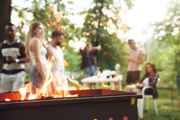 Group of friends making barbecue in the backyard. concept about good and positive mood with friends