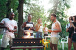 © master1305 - Group of friends making barbecue in the backyard. concept about good and positive mood with friends