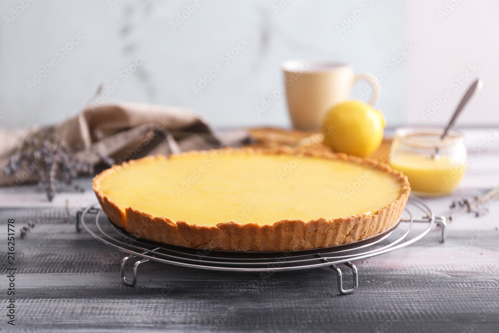 Tasty lemon pie on wooden table