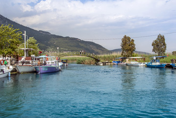 Wall Mural - Mugla, Turkey, 14 May 2012: Bridge and Boats at Azmak Stream, Gokova Bay, Akyaka