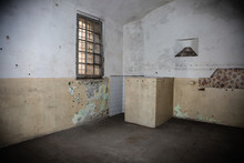Empty Room With A Toilet In An Old Prison