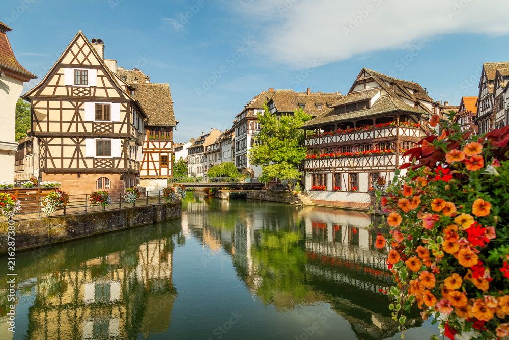 Little France (La Petite France), a historic quarter of the city of Strasbourg in eastern France. Charming half-timbered houses. Famous Maison de Tanneurs house. - obrazy, fototapety, plakaty 
