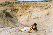 © LIGHTFIELD STUDIOS - young tender couple hugging and lying in sand canyon