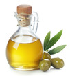 Leinwandbild Motiv Bottle of olive oil and green olives with leaves