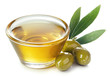 Bowl of olive oil and green olives with leaves