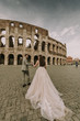 © BGStock72 - Young wedding couple by the Colosseum in Rome, Italy