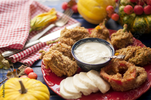 Fotografie, Obraz Baked pumpkin flowers with mozzarella cheese and in batter