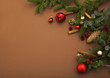 christmas background with cinnamon, apple, christmas tree on brown backround
