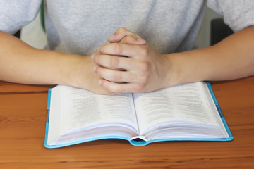 Wall Mural - Open Bible. The guy is reading the Bible