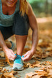 © Microgen - Woman Exercising Outdoors in The Fall