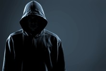 Thief In Black Clothes On Grey Background