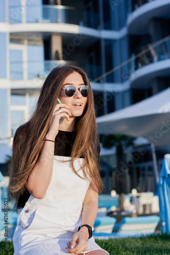 Beautiful Longheared Young Woman With Long Hair Has Fun Uses A Smartphone Calls Writes Sms Surfing In Internet Makes Selfy At Sunrise Stock Photo Adobe Stock