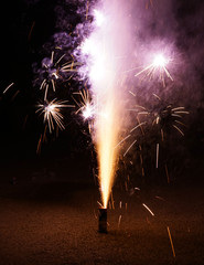 Wall Mural - colorful fountain fireworks stream into dark night