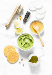 Wall Mural - honey and avocado face mask on light background, top view. beauty, youth, skin care concept. flat la