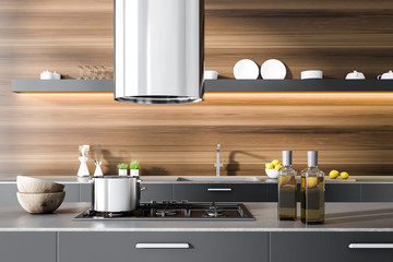 Gray kitchen countertop in wooden room, oven