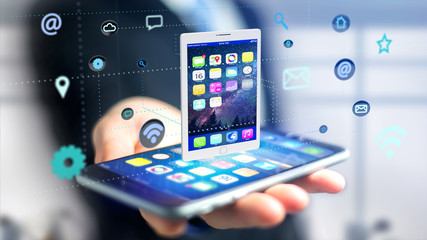 Poster - Businessman using a smartphone with a tablet surrounding by app and social icon - 3d render