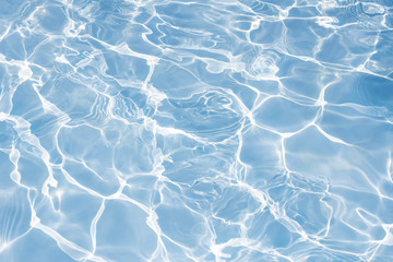 Texture of water in swimming pool for background