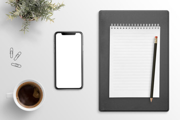 Aufkleber - Modern smart phone on white desk surrounded with office accessories. Flat lay, black and white scene.
