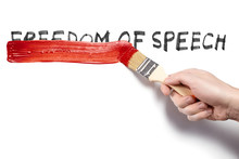 Hand Painting Over The Words "Freedom Of Speech" Using A Red Brush, Isolated On White Background