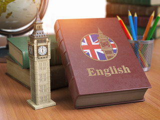 Poster - Studying and learn English concept. Book with flag of Great Britain and Big Ben tower on the table.